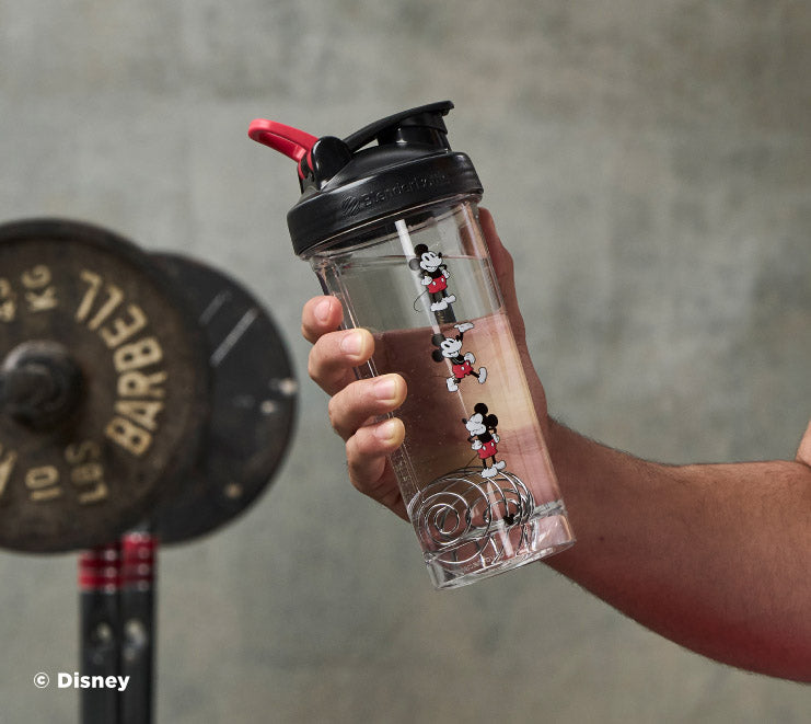 pro-series-a7 Mickey_Mouse_Protein_Shaker_Bottle_Being_Held_In_the_Gym.jpg